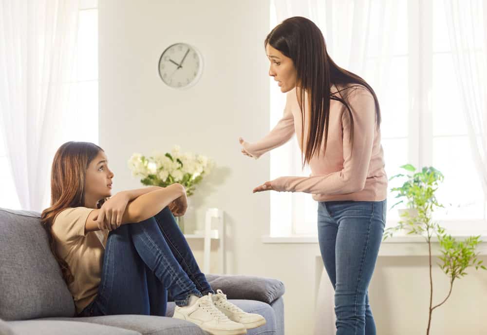 Mother and teen daughter conflict at home, scolding grown up child, angry mum feeling stressed, misunderstandings, generational gap, difficulties in relationships, serious disagreement or argument