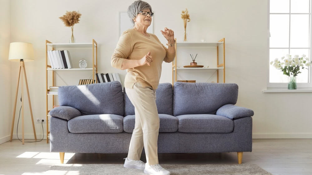 Old active senior happy woman enjoying walking, joyful dancing in new sport shoe for running, foot care, orthopedic health, wearing comfortable medical orthotic shoes, relieve pain, staying healthy
