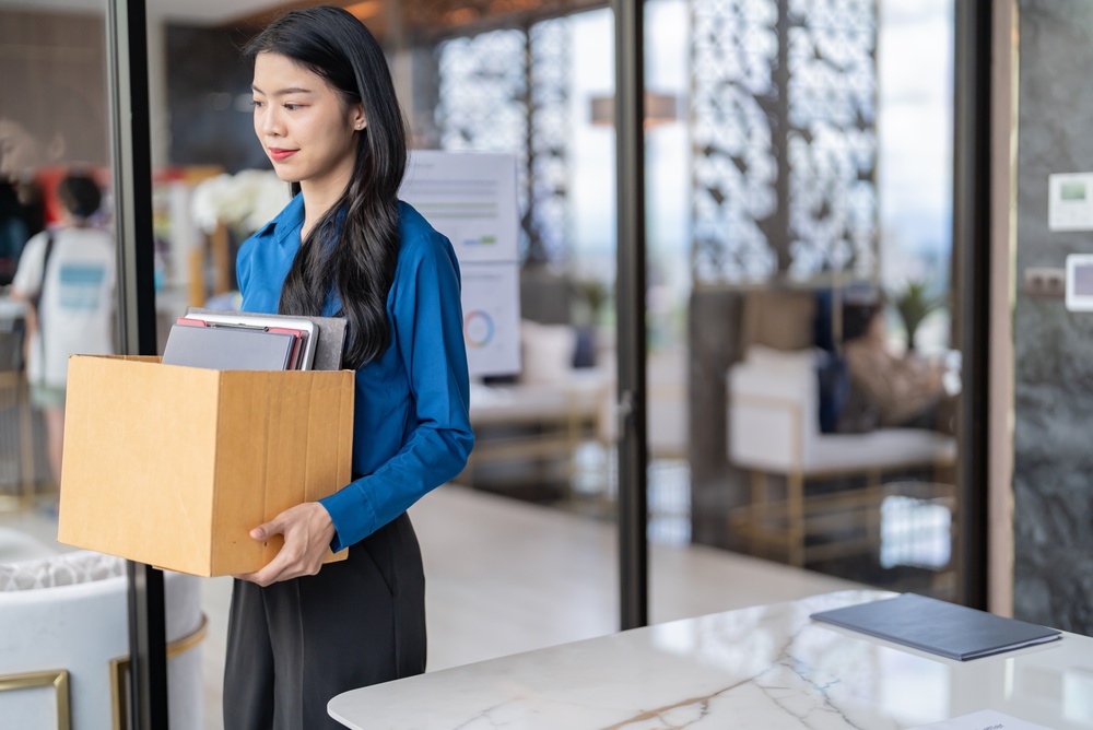 Quit Job asian business woman sending resignation letter and packing Stuff Resign Depress or carrying business cardboard box in office. Change of job or fired from company.