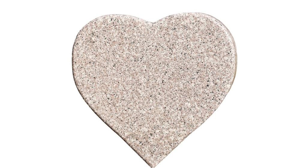 Marble heart shape stone isolated on white background. Decorative natural granite heart symbol cutout with copy space. Minimalist stone object used for design decoration love concept