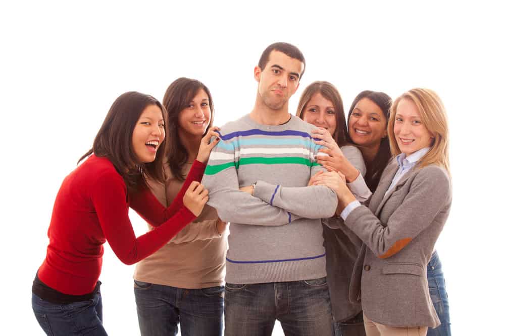 Young Handsome Man with Many Girls Around