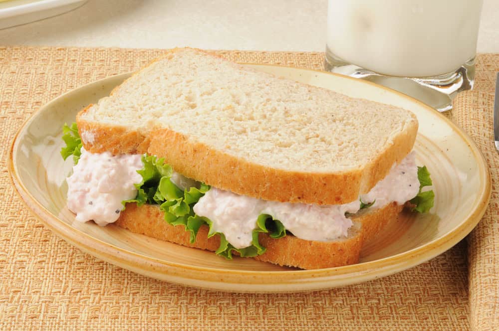 A ham salad sandwich on oat bread