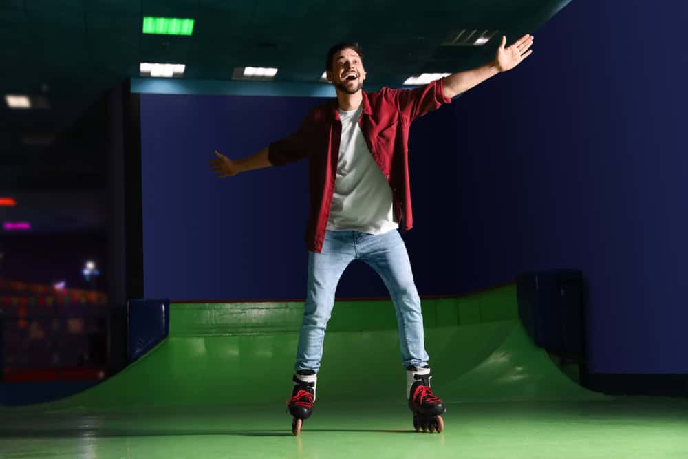 Man having fun at roller skating rink