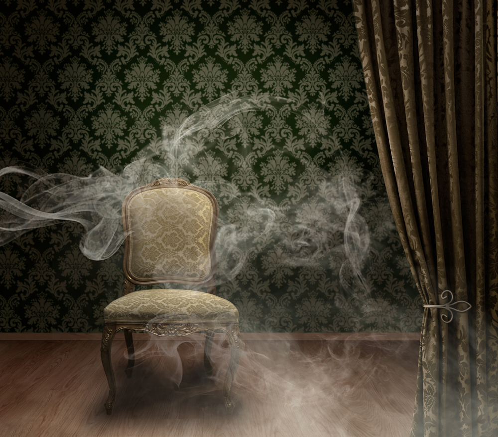 Antique empty chair on mystic dark stage with smoke trails dramatic background damask pattern wall
