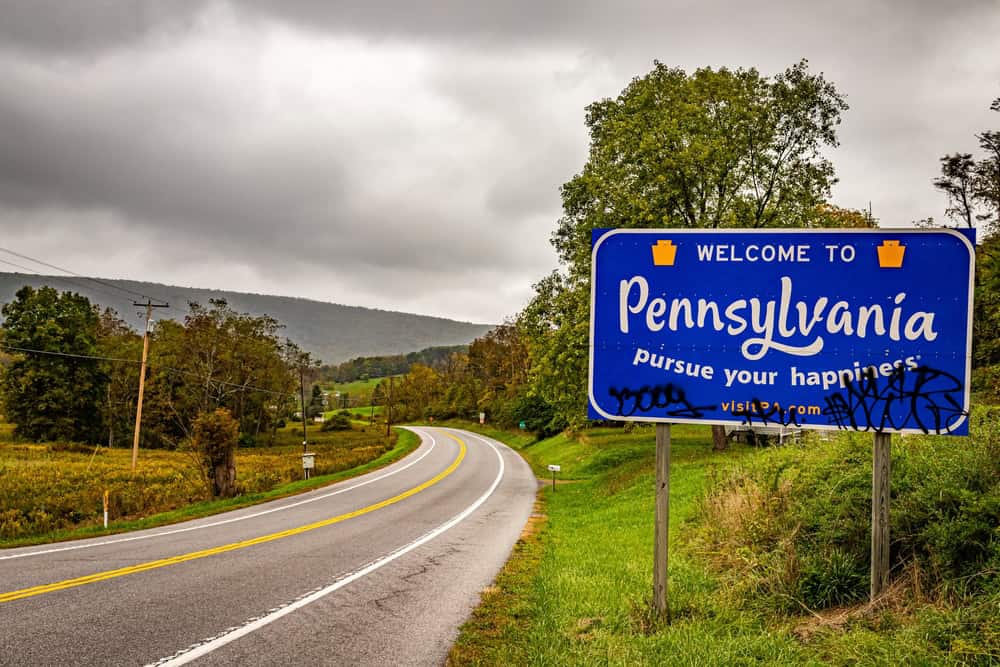 Bedford, PA - October 7, 2021: A Welcome to Pennsylvania state line highway sign on the border shared with Maryland.