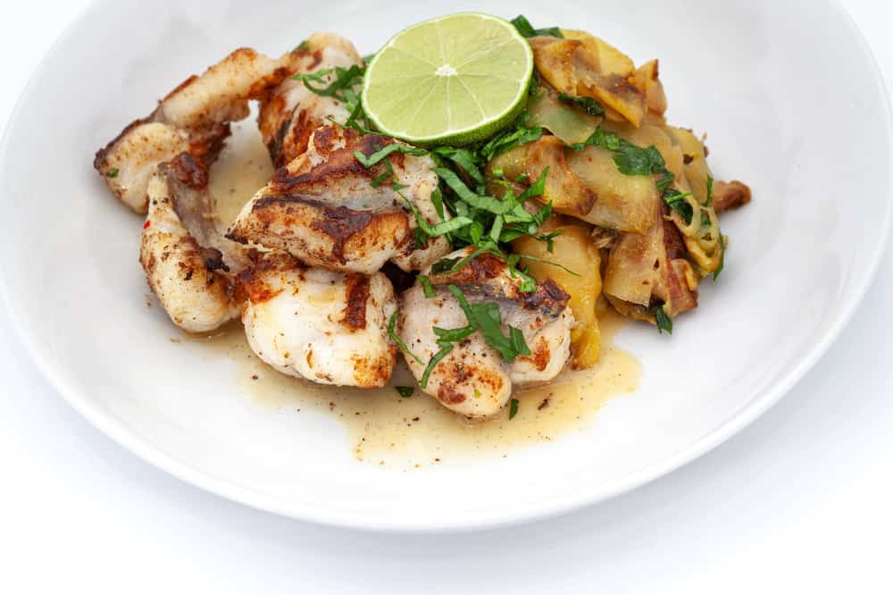 Fried monkfish and zucchini on a plate