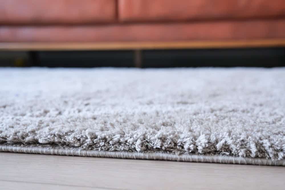 carpet texture background on wooden floor with copy space