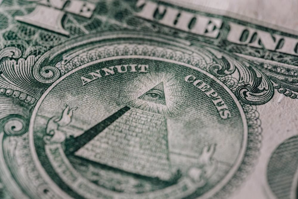 Intricate Engraving: Close-Up of the All-Seeing Eye on One Dollar Bill, a Symbol of American Wealth and the Mystery of the Illuminati