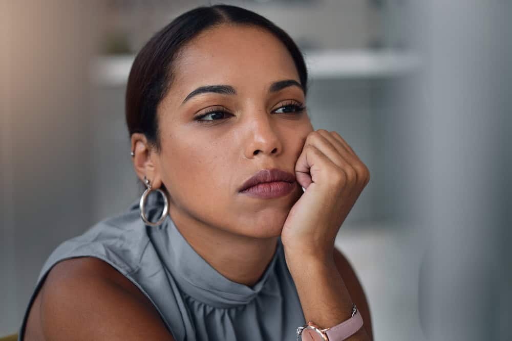 Businesswoman, bored and office with thinking, deadline and overtime for goals. Tired creative writer, professional news editor and expert reporter for content creation, publishing and press startup