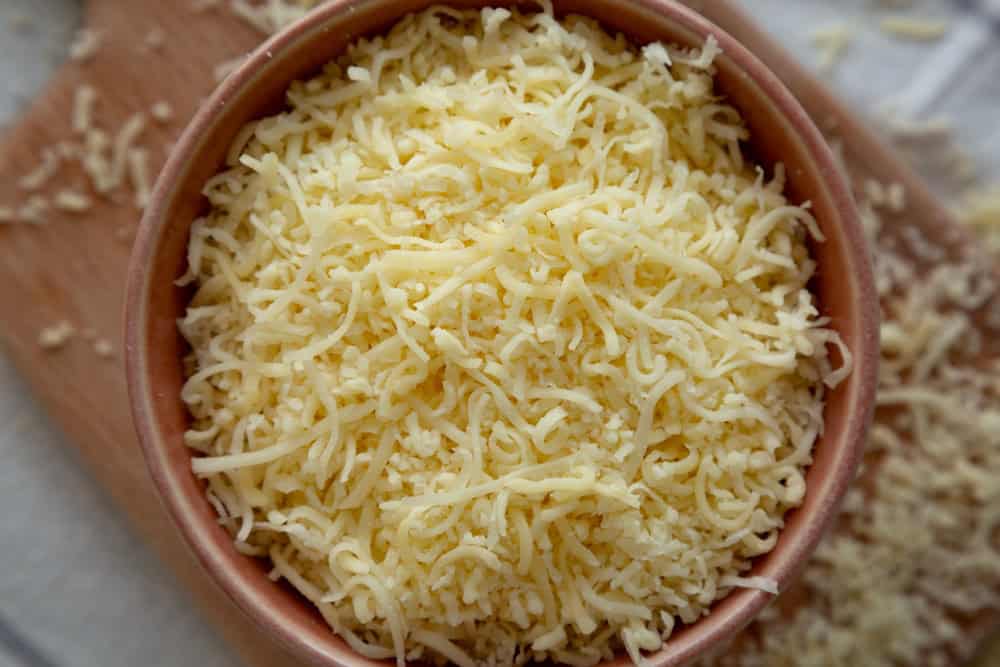 Organic Grated Cheese Mix in a Bowl, top view.