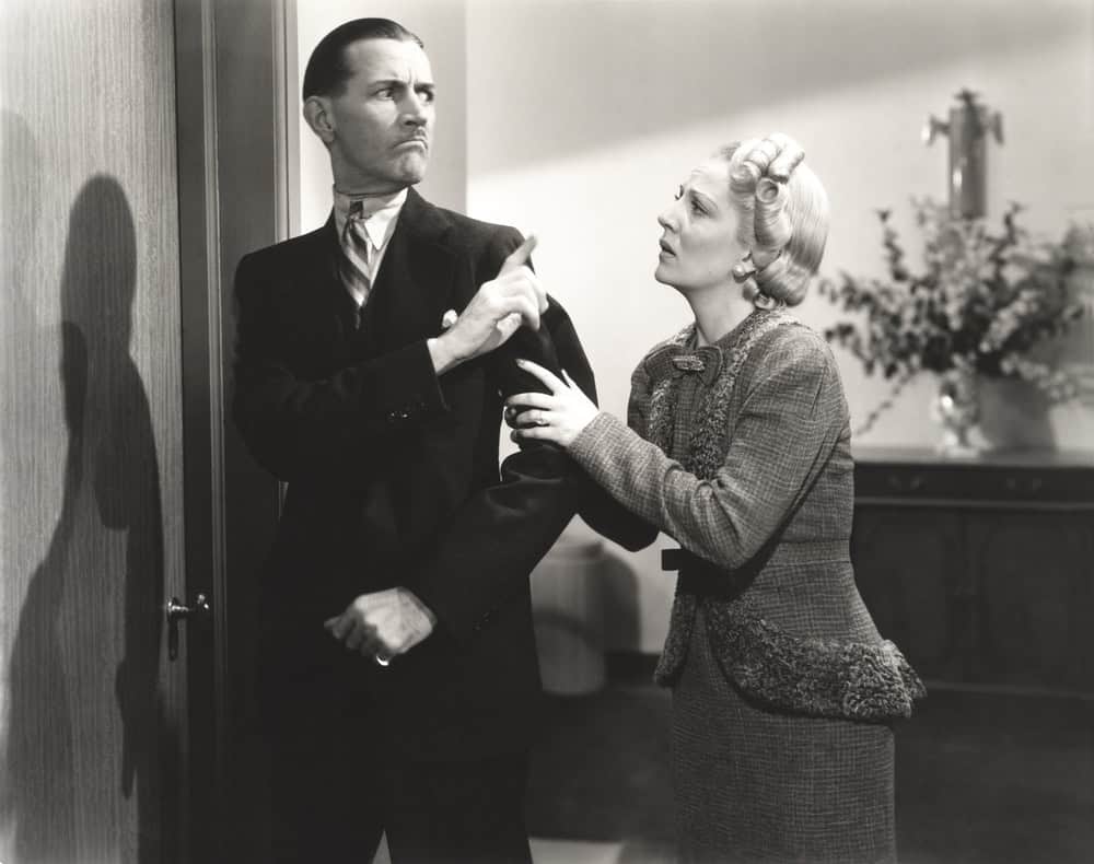 Persistent woman pleading with angry man