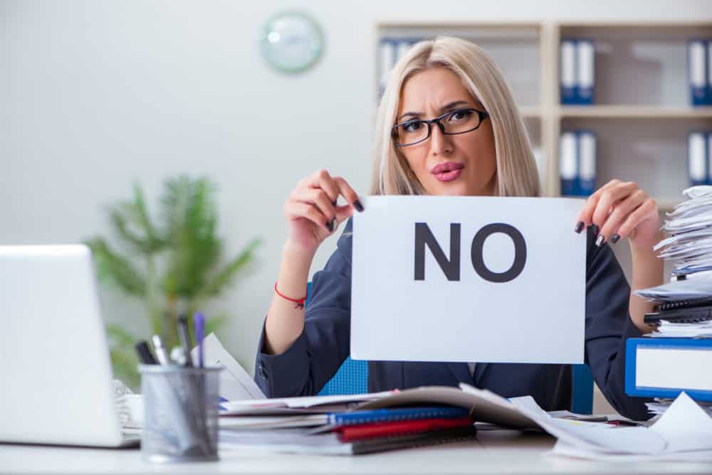 Businesswoman with message in office at desk