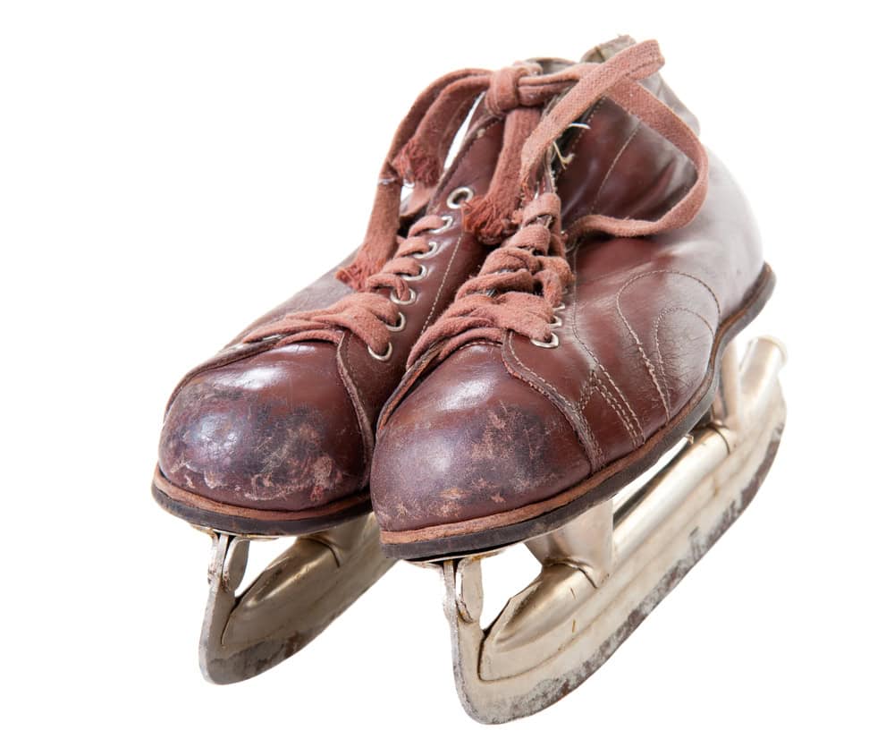 Old retro skates isolated over white background