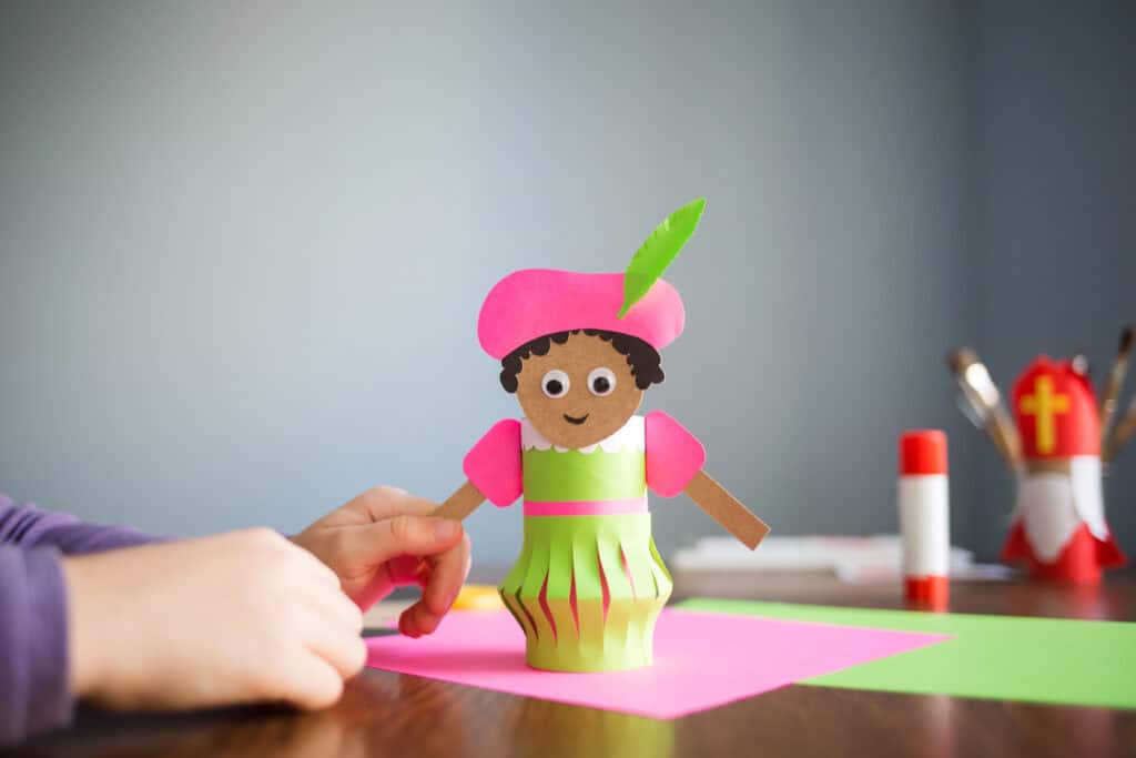 Paper craft for kids. DIY toy Black Pete Zwarte Piet for sinterklaas day. create art for children.