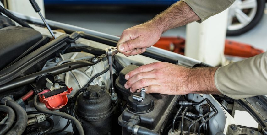 Mechanic servicing a car at Bluestone Automotive