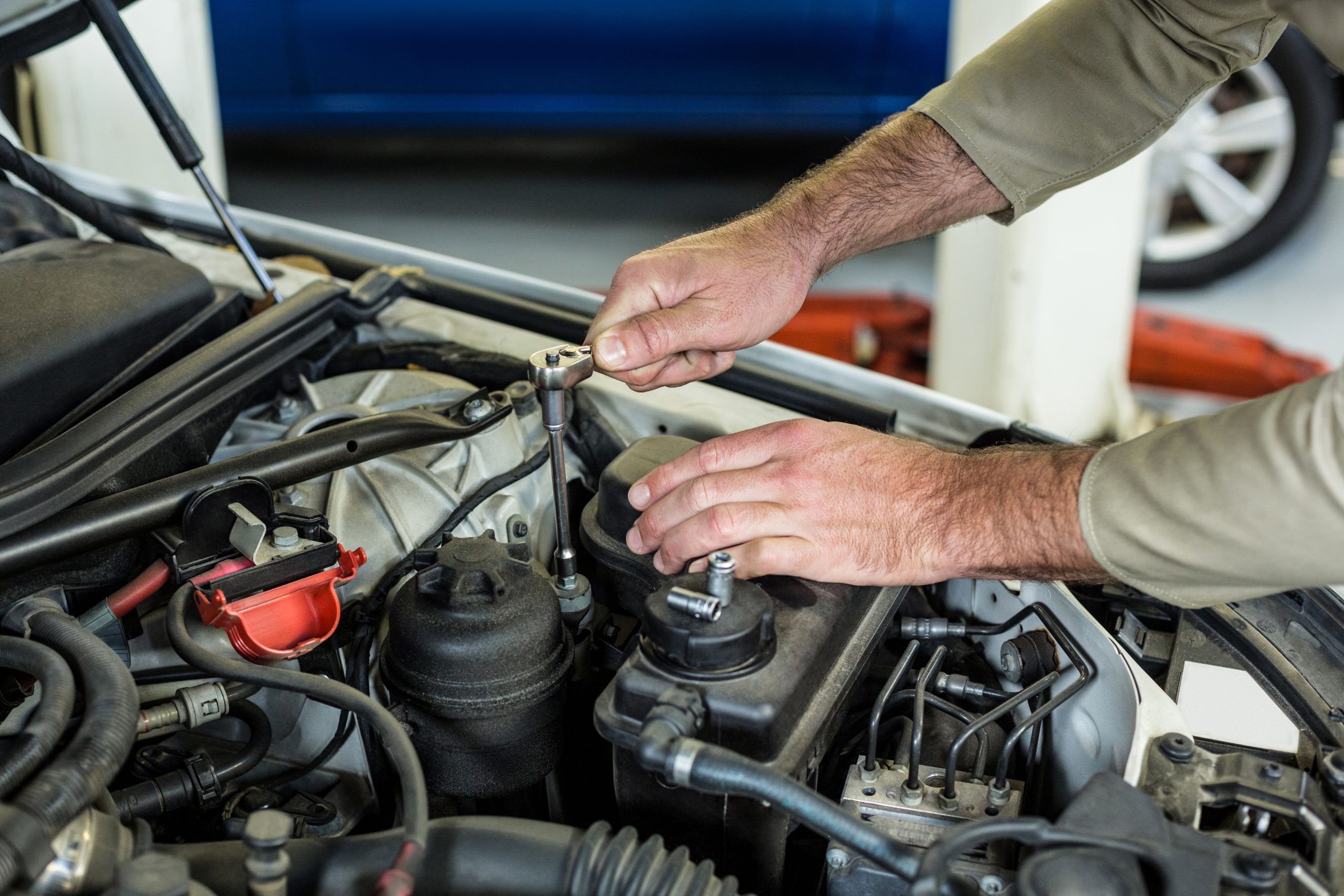 Mechanic servicing a car at Bluestone Automotive