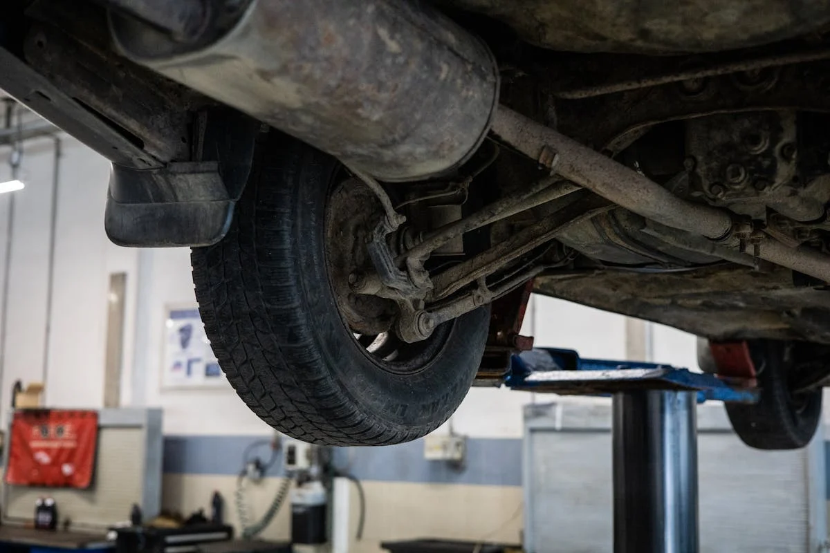 Vehicle suspension system inspection at Cor's Motors Auto Repair.