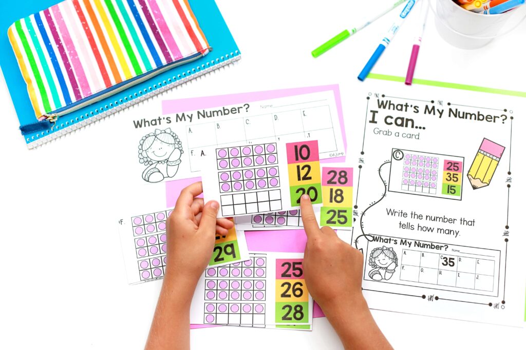 Completing a "What's My Number?" math center activity