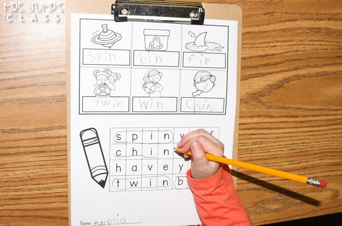 A student completes a word search on a write the room recording sheet