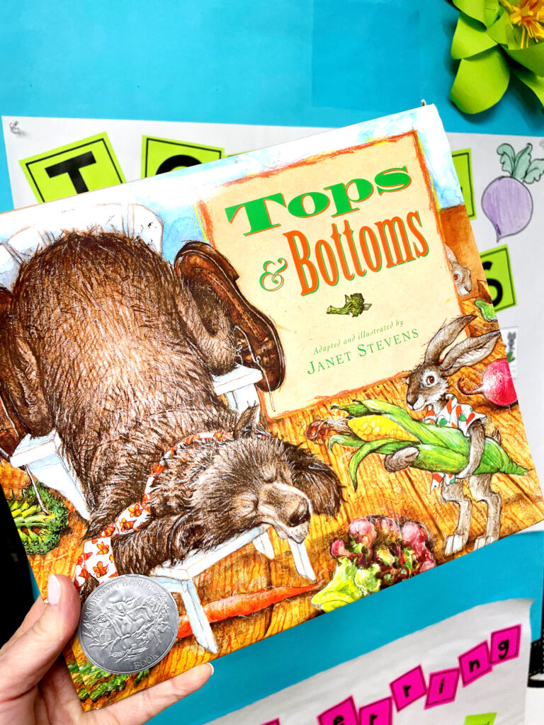Holding a Tops and Bottoms book