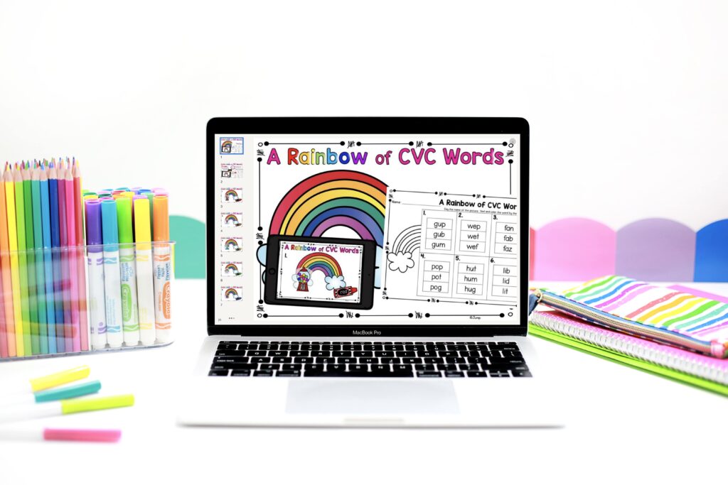A digital activity called "A Rainbow of CVC Words" is displayed on a laptop