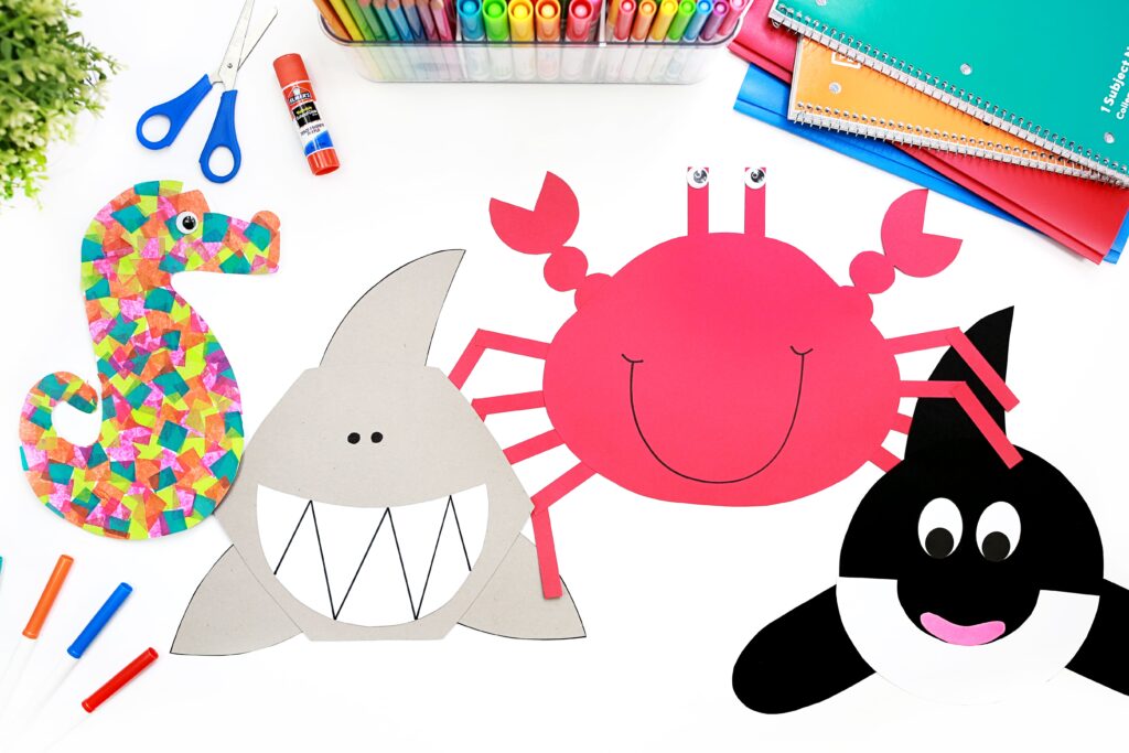 Four ocean animal crafts - seahorse, shark, crab, orca
