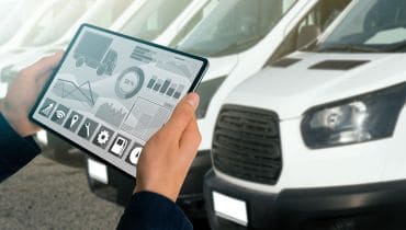 Advanced vehicle diagnostics being performed on a white van.
