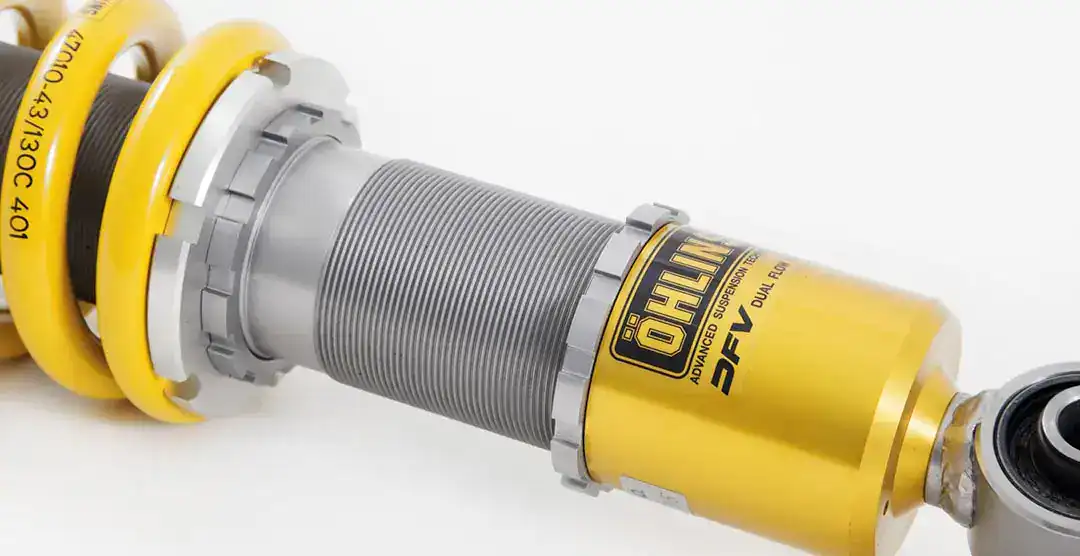 High-performance Öhlins suspension shock absorber for automotive applications.