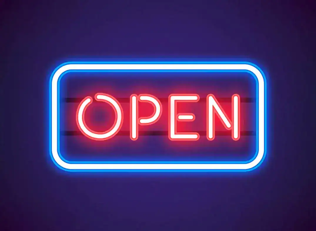 Bright neon open sign for automotive repair shop during Covid-19.