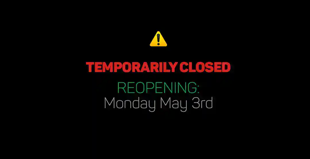 Temporarily closed sign for European Automotive with reopening date.