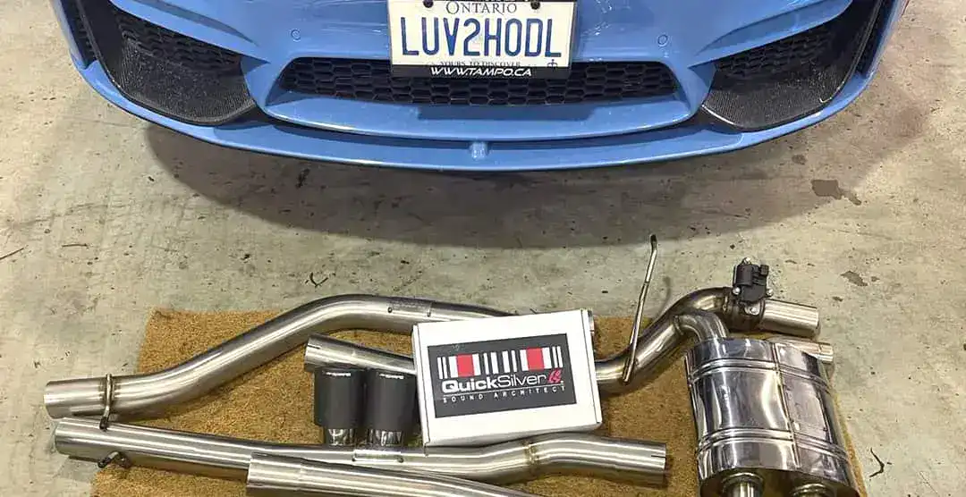 Blue car with Ontario license plate and new Quicksilver exhaust system.