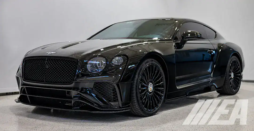 Black Bentley Onyx concept car with forged carbon details and sleek design.