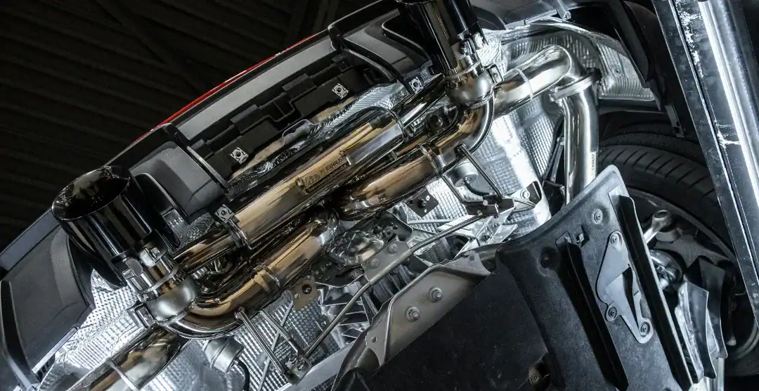 Close-up of European automotive engine and exhaust system.