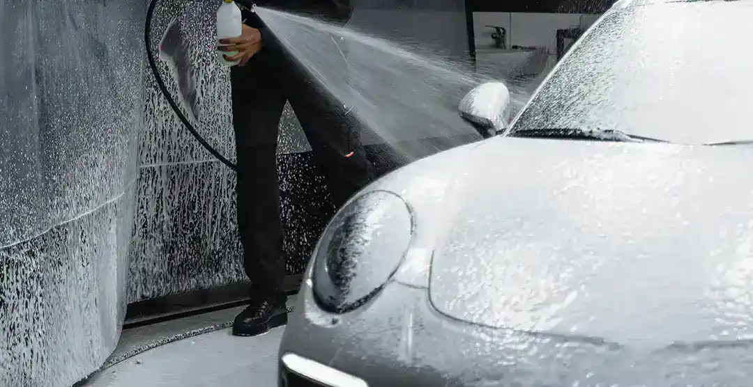 Car being detailed with foam and water at European Automotive.