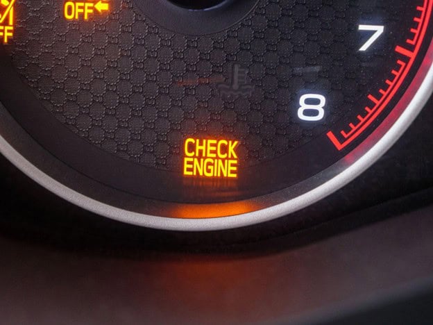 Check engine light on a European car dashboard.