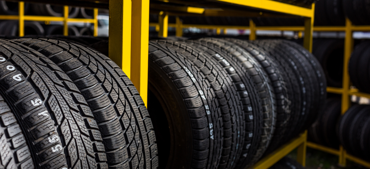 Wide view of new tires in a tire shop at HeVtech Mechanic & Tire Services.