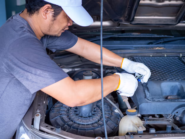 mechanic-holding-block-wrench-handle-while-fixing-car_233554-303.avif