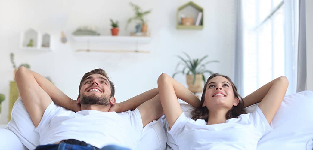 couple thinking on sofa