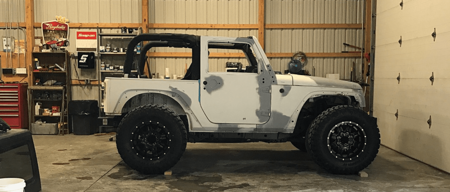Custom off-road vehicle in workshop at John's Automotive.