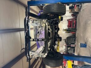 Car frame being repaired at John's Automotive auto shop.