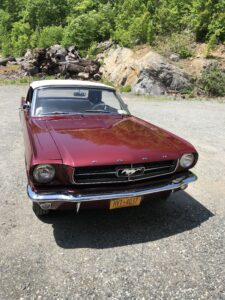 Vintage Ford Mustang in deep red color.