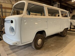 Restored classic van with fresh white paint and detailed bodywork. Perfect for vintage vehicle enthu.