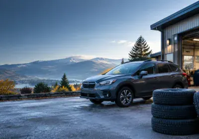 L Stop Auto service center with a car and mountain background in Ontario.