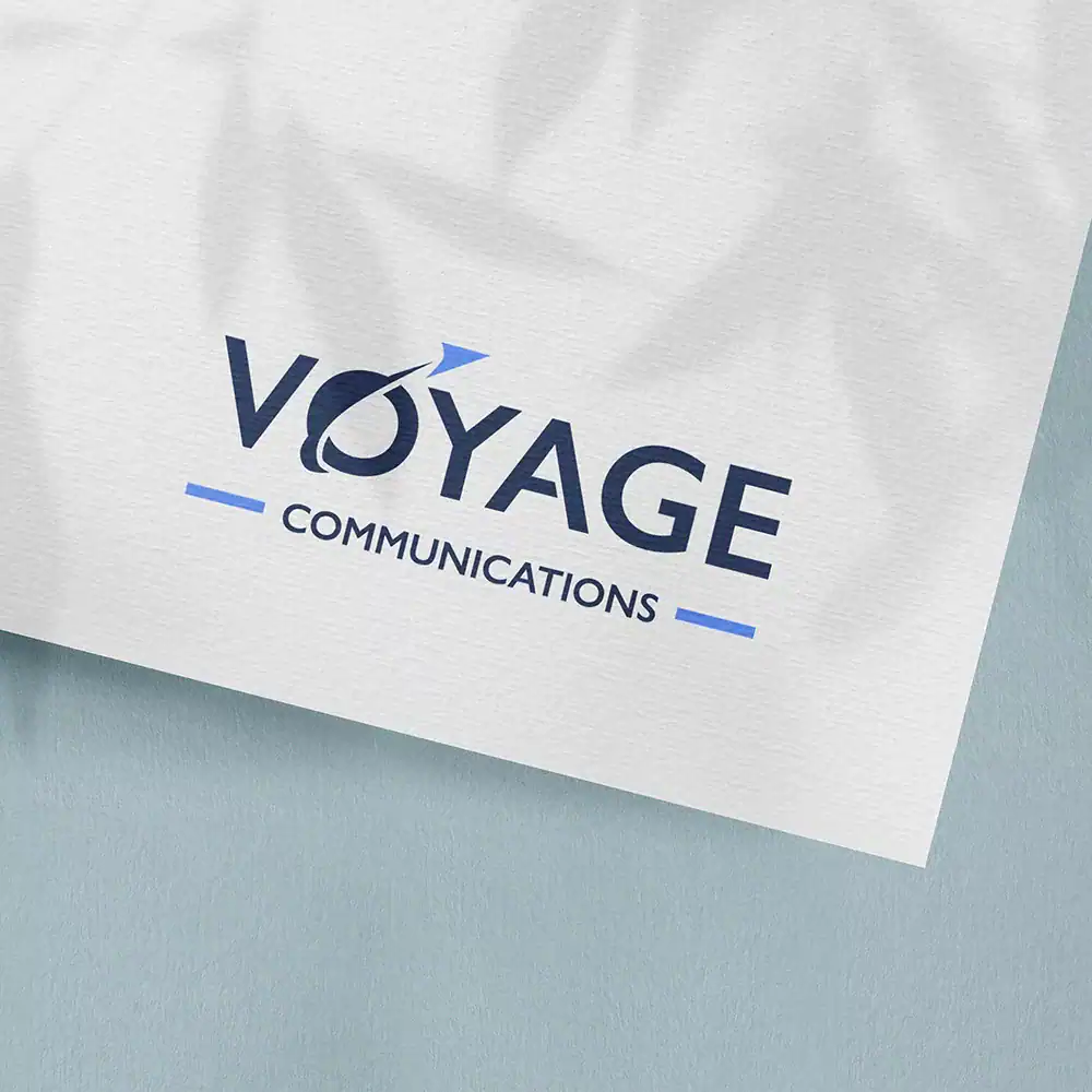 Voyage Communications logo on business card, branding, marketing, digital marketing agency, professional services.