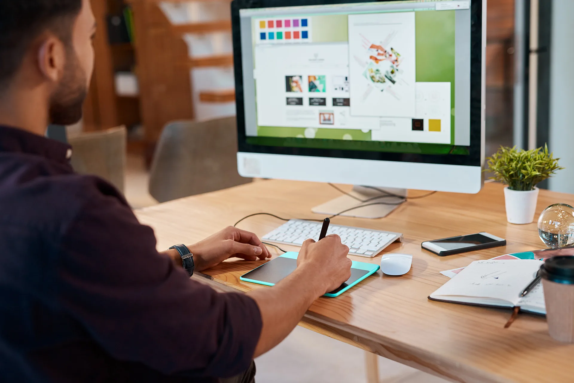Man designs creative project on computer tablet 2026 09 22 05 38 48 utc
