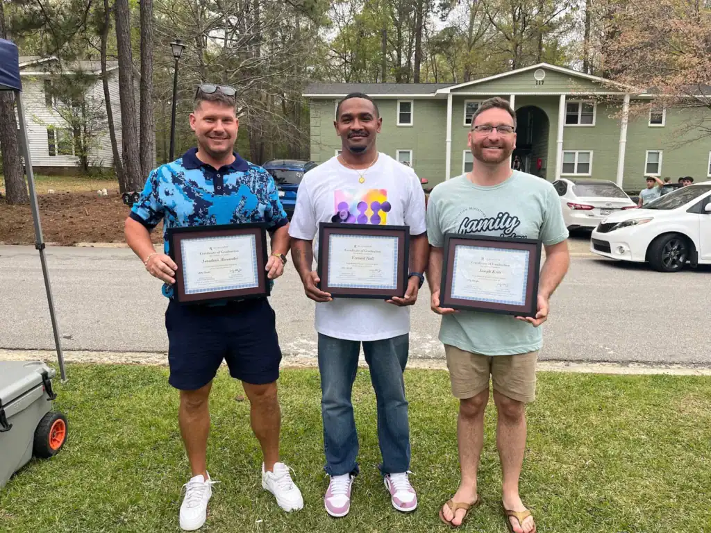 March graduates Jonathan A., Vernard H, and Joe K