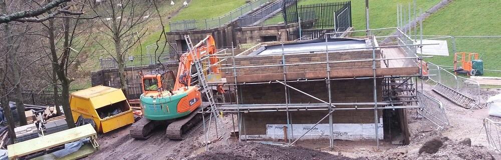 Turbine house emerges out of the ground at Dovestone Reservoir