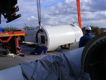 renewables first - lifting the nacelle onto the wind turbine tower sections
