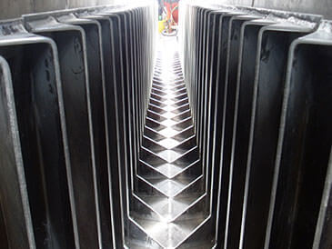 Steel fabricated baffles in concrete channel Alaskan ‘A’ fish pass.