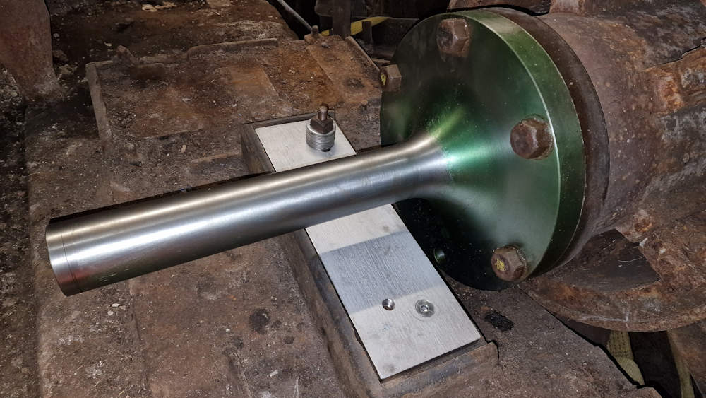 the newly cast and machined long stub axle, its installation with the stainless-steel support plate